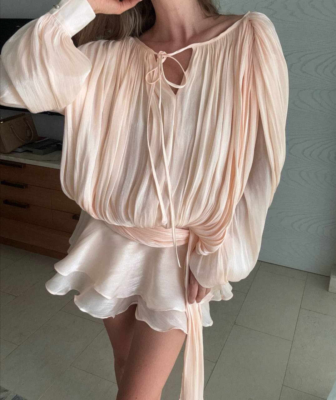 Peach mini dress with draped silhouette