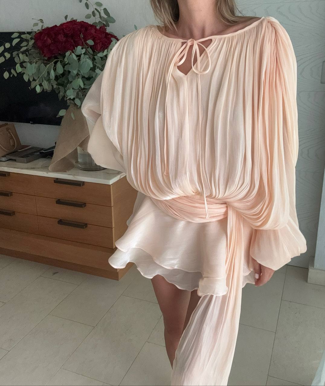 Peach mini dress with draped silhouette