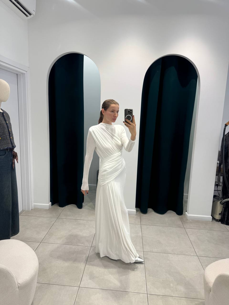 White maxi dress with elegant asymmetric rushing