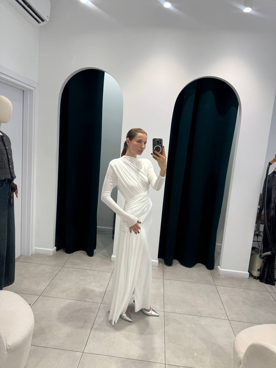 White maxi dress with elegant asymmetric rushing