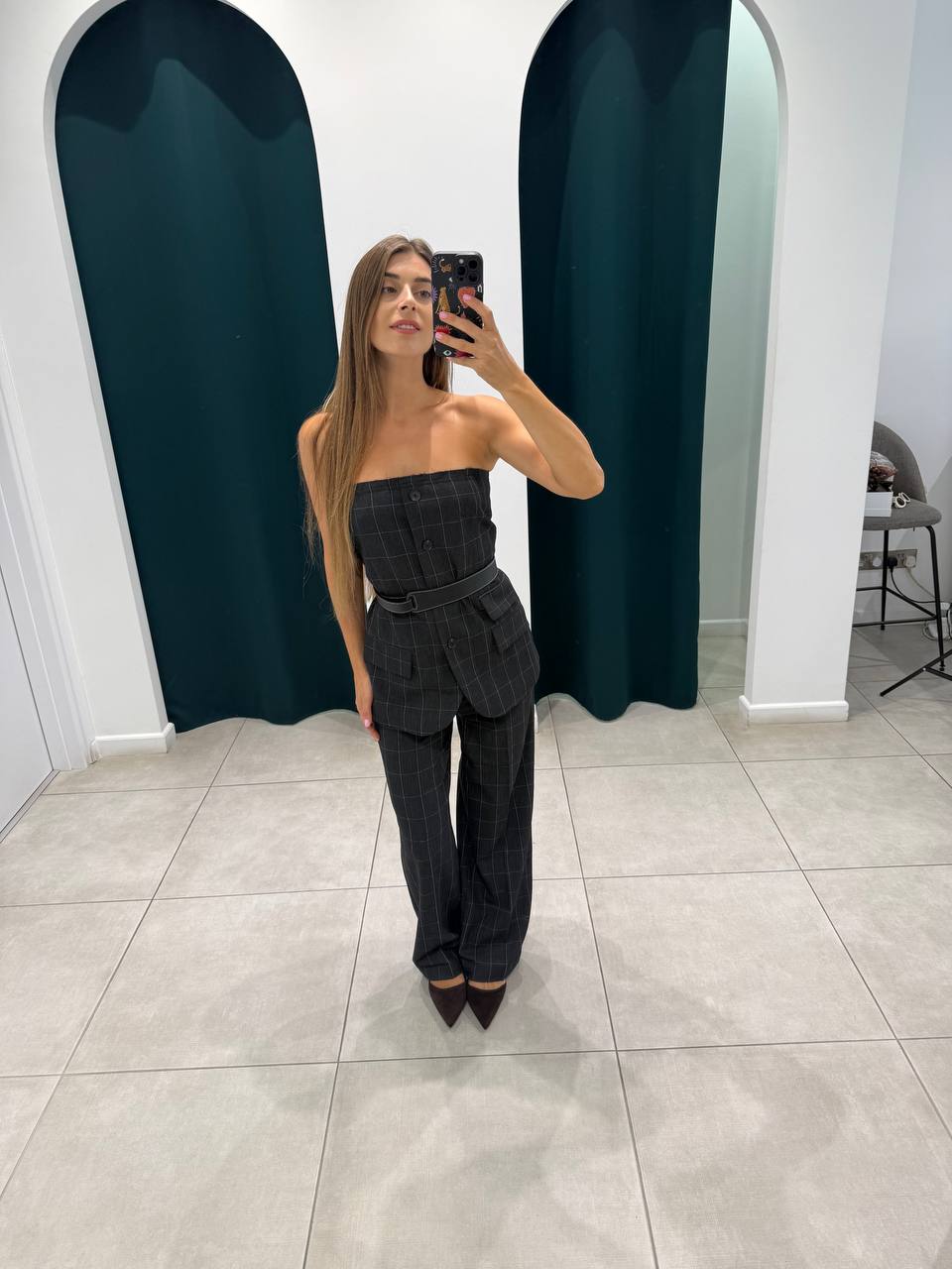 Dark grey sleeveless top with trousers