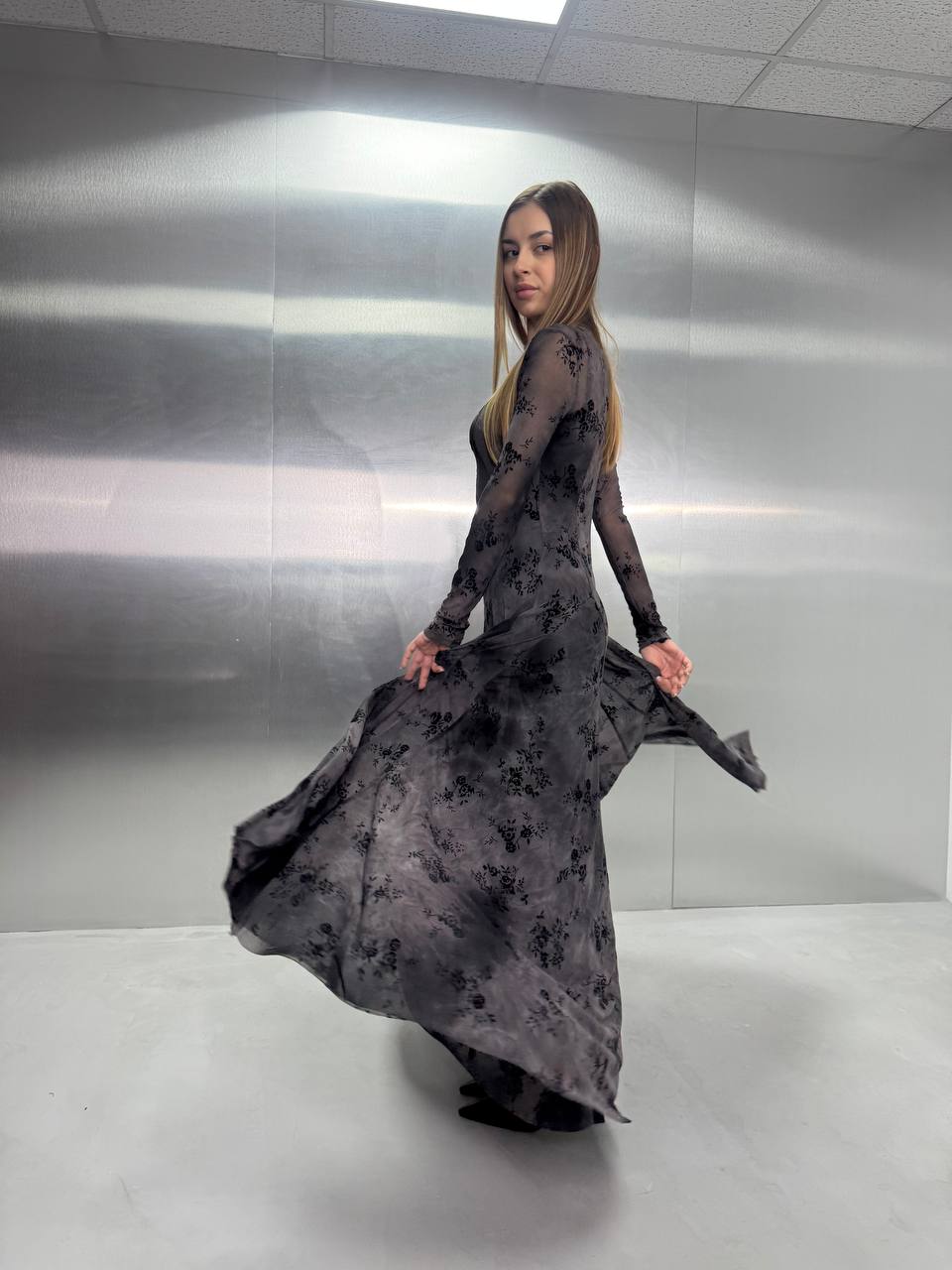 Long-sleeve sheer mesh maxi dress with a dark floral print