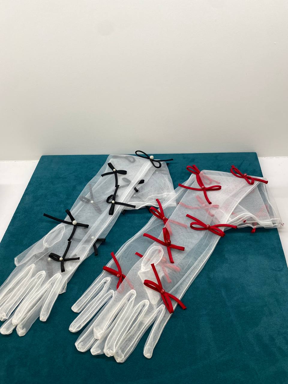 Gloves with black bows