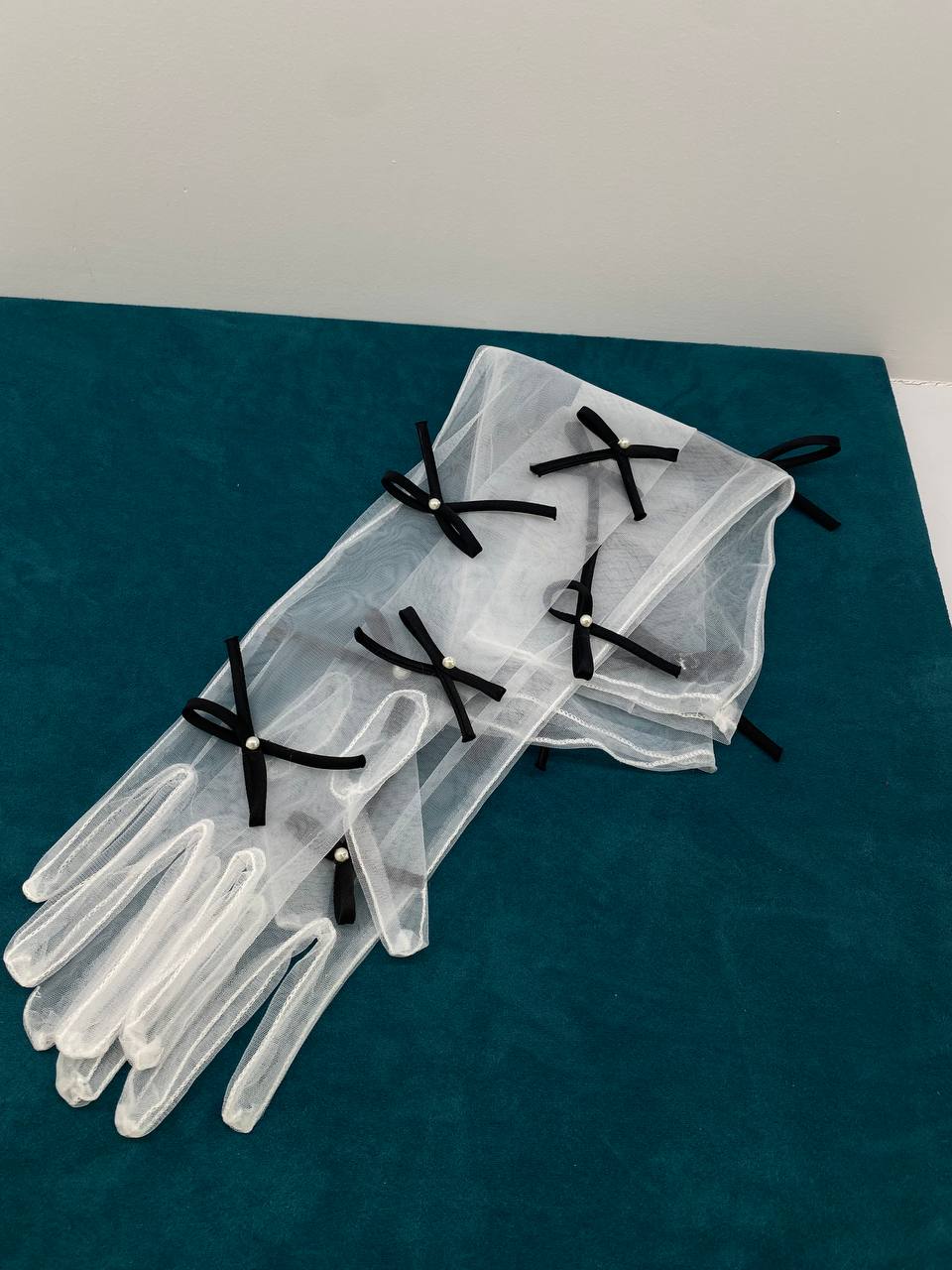 Gloves with black bows